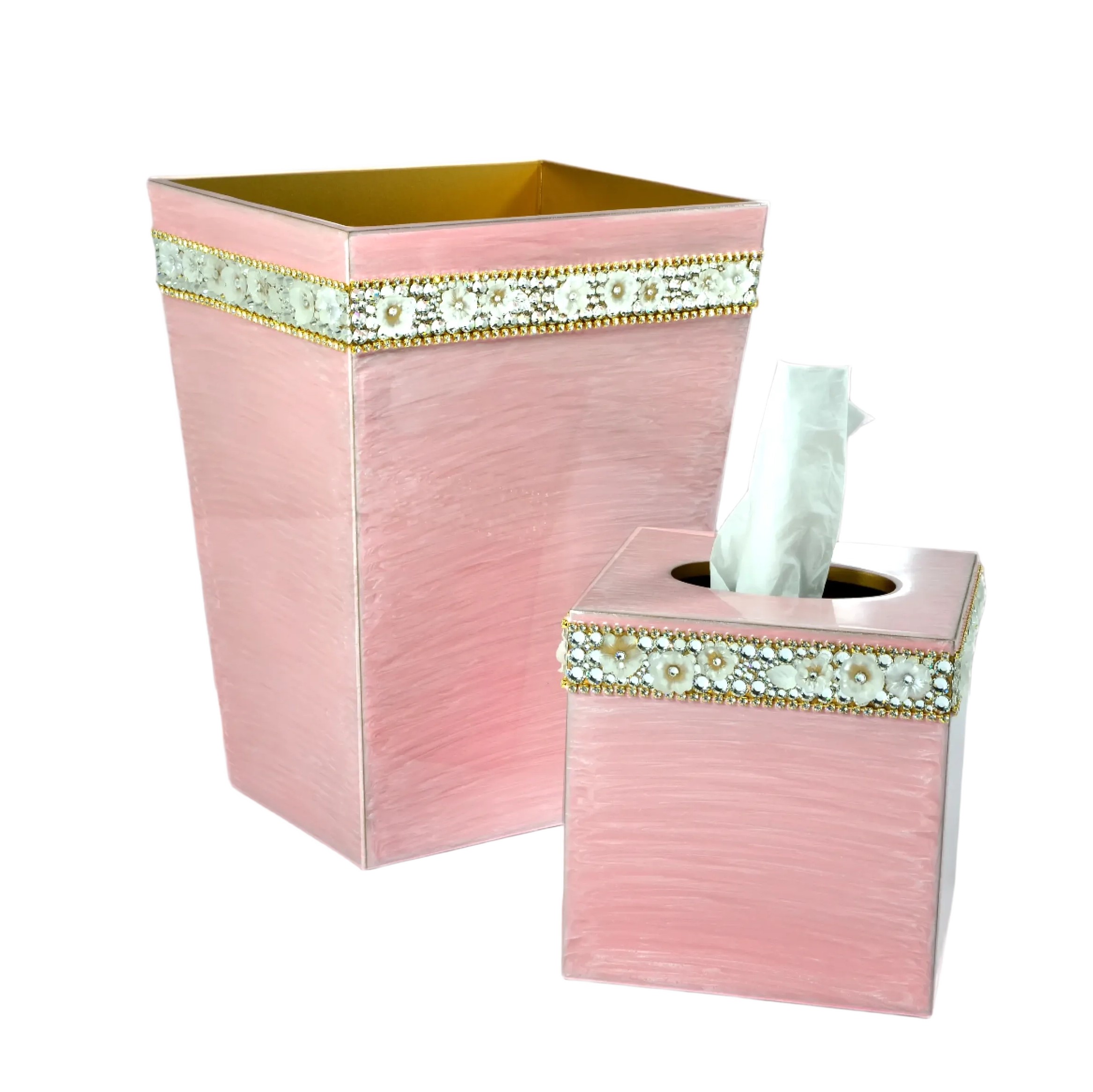 Pink bathroom set with decorative waste bin and tissue box on a white background