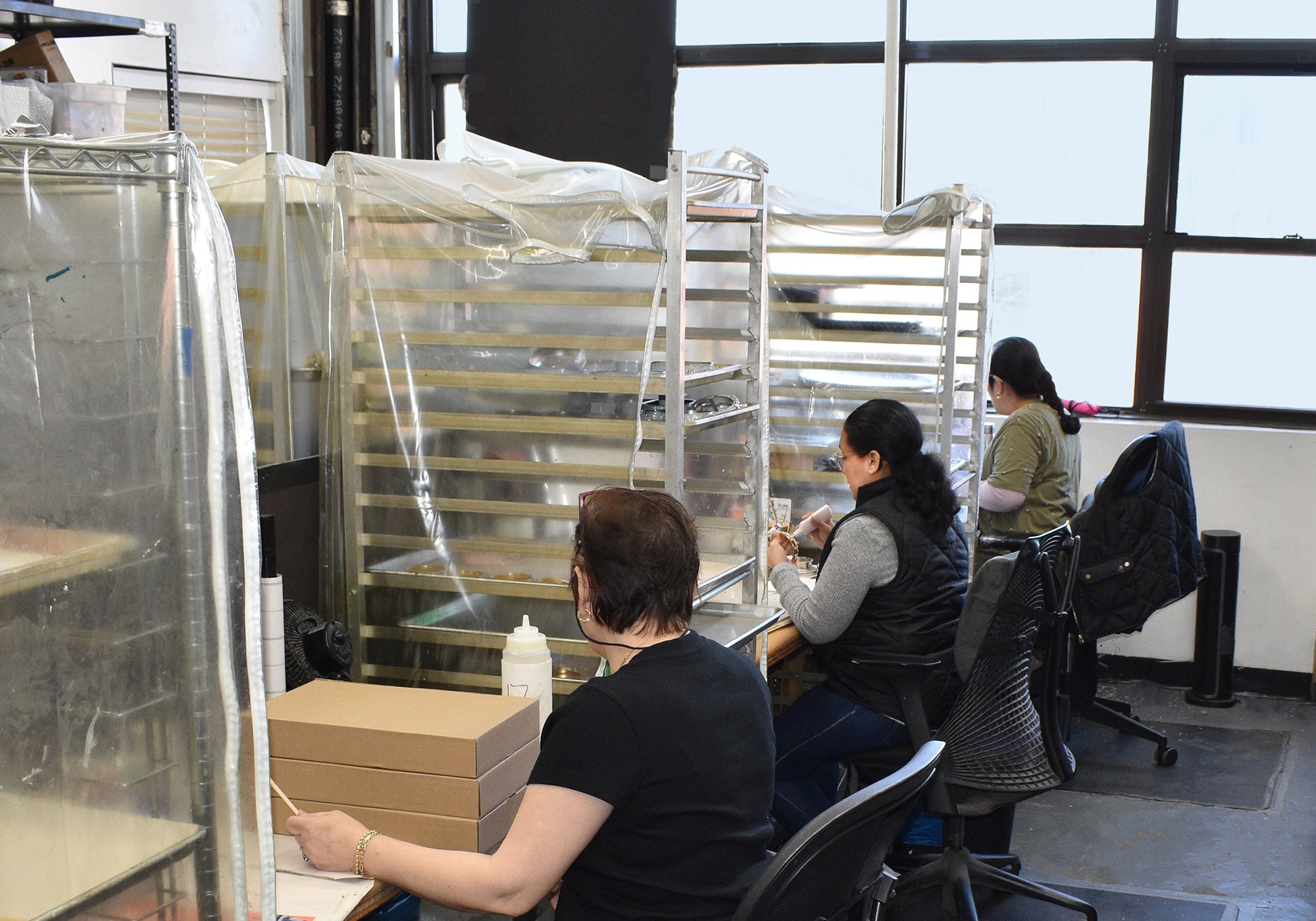 Staff working on Mike+Ally Collections