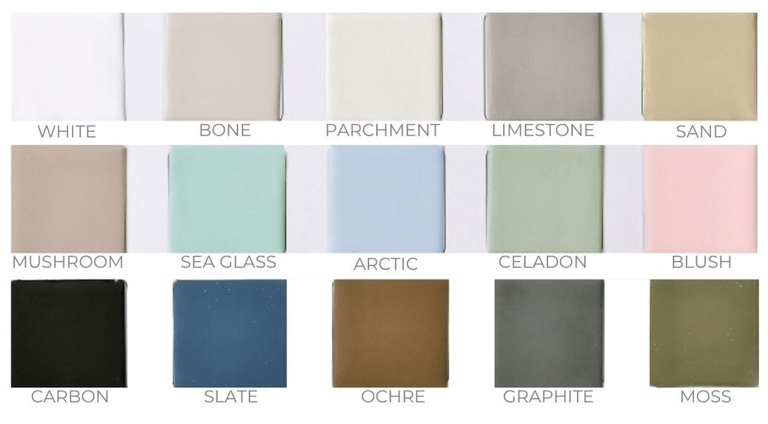 A color swatch grid showing 15 square paint or material samples labeled with names such as White, Bone, Parchment, Limestone, Sand, Mushroom, Sea Glass, Arctic, Celadon, Blush, Carbon, Slate, Ochre, Graphite, and Moss.