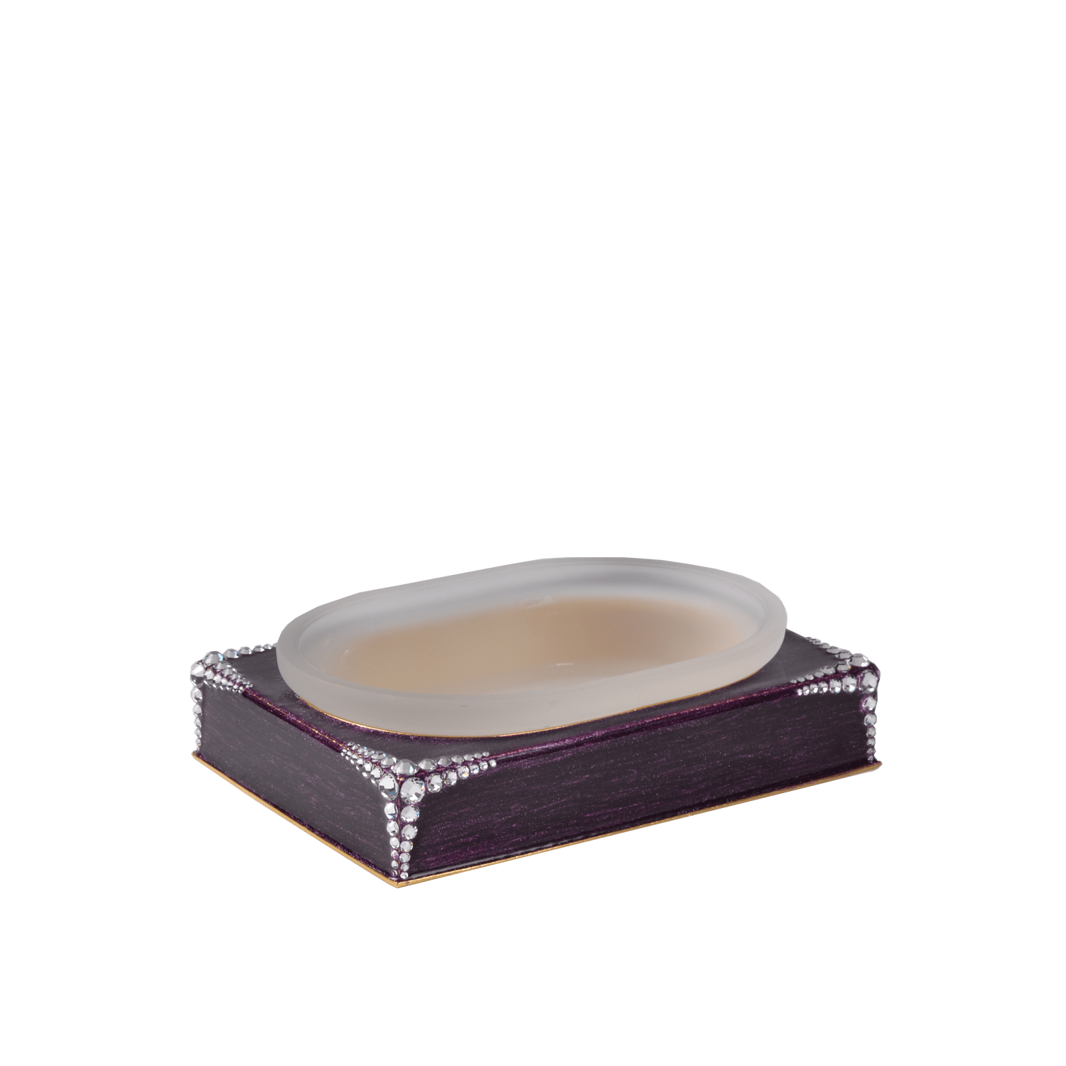A clear glass soap dish with a decorative edge, placed on a purple base with sparkling embellishments.