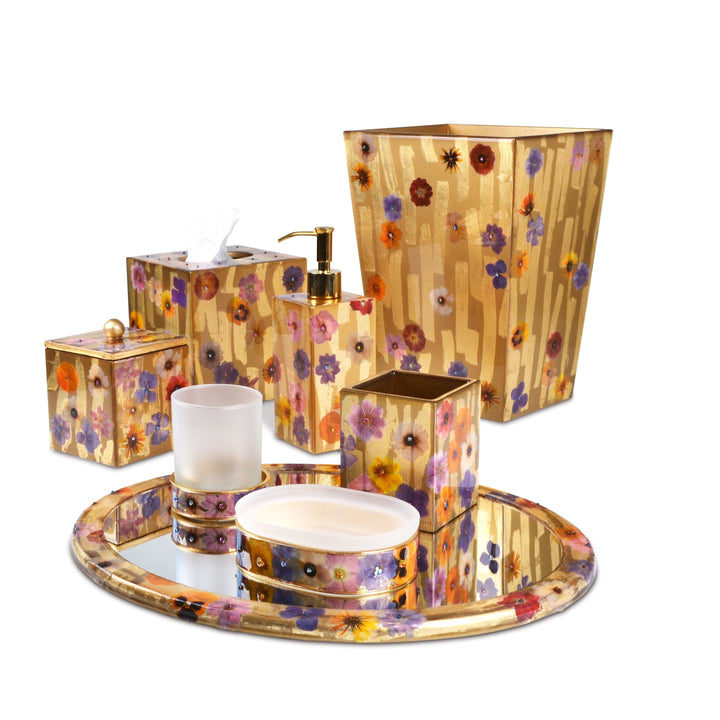 A fresh and organic bath accessory set decorated with wildflowers on gold.