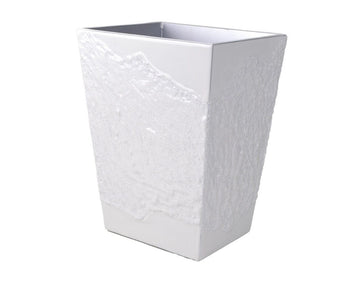 White wastebasket finished in a rough and smooth texture