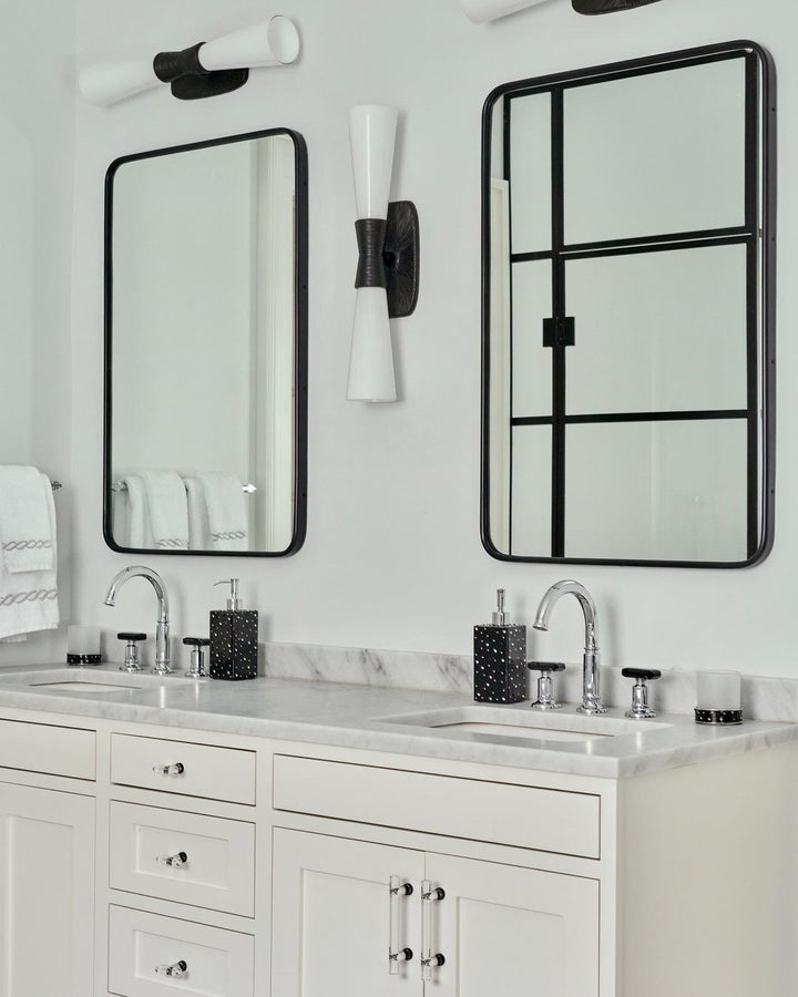 Contemporary white bathroom interior with black Mike + Ally bathroom lotion pump and tumbler