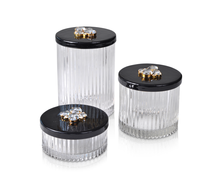 A set of three size fluted glass jars with choice of hand enameled lids accented with crystals in gold settings.