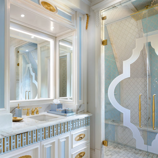 Opulent blue bathroom interior with blue Mike +Ally bath accessories